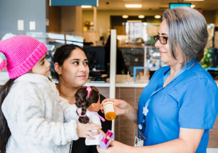 nurse and latina mom, young child